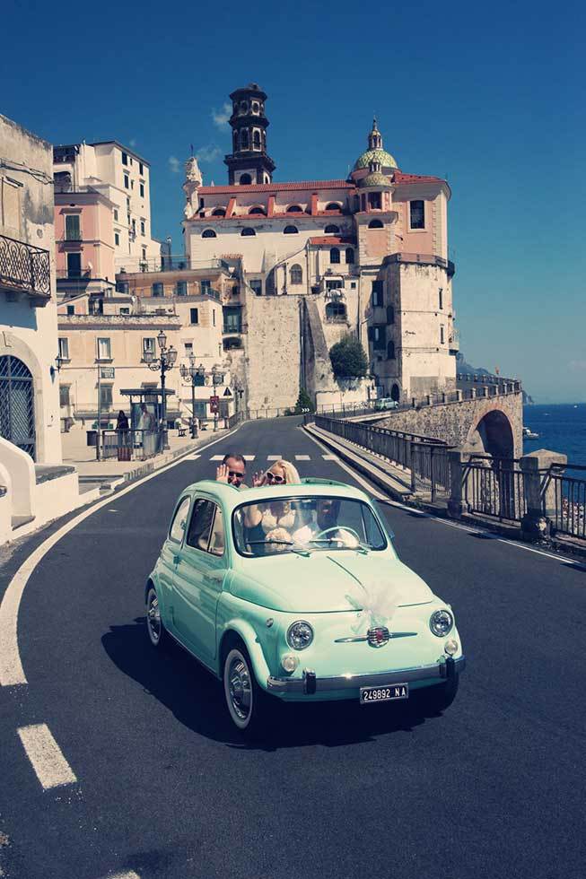 Bridal couple on a vintage cinquecento on the Amalfi Coast
